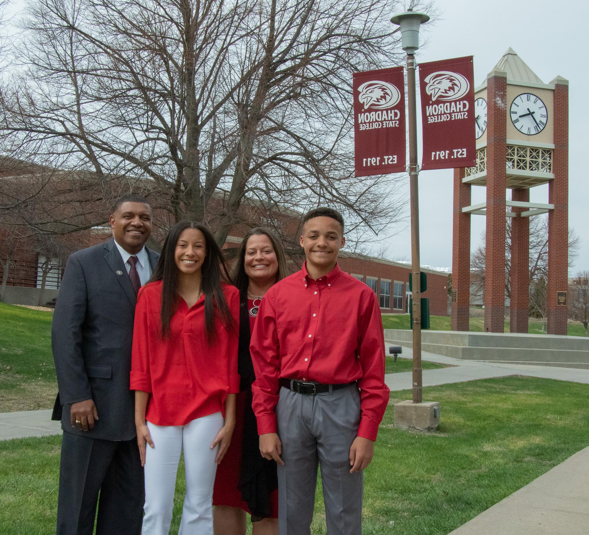 Four people standing outside